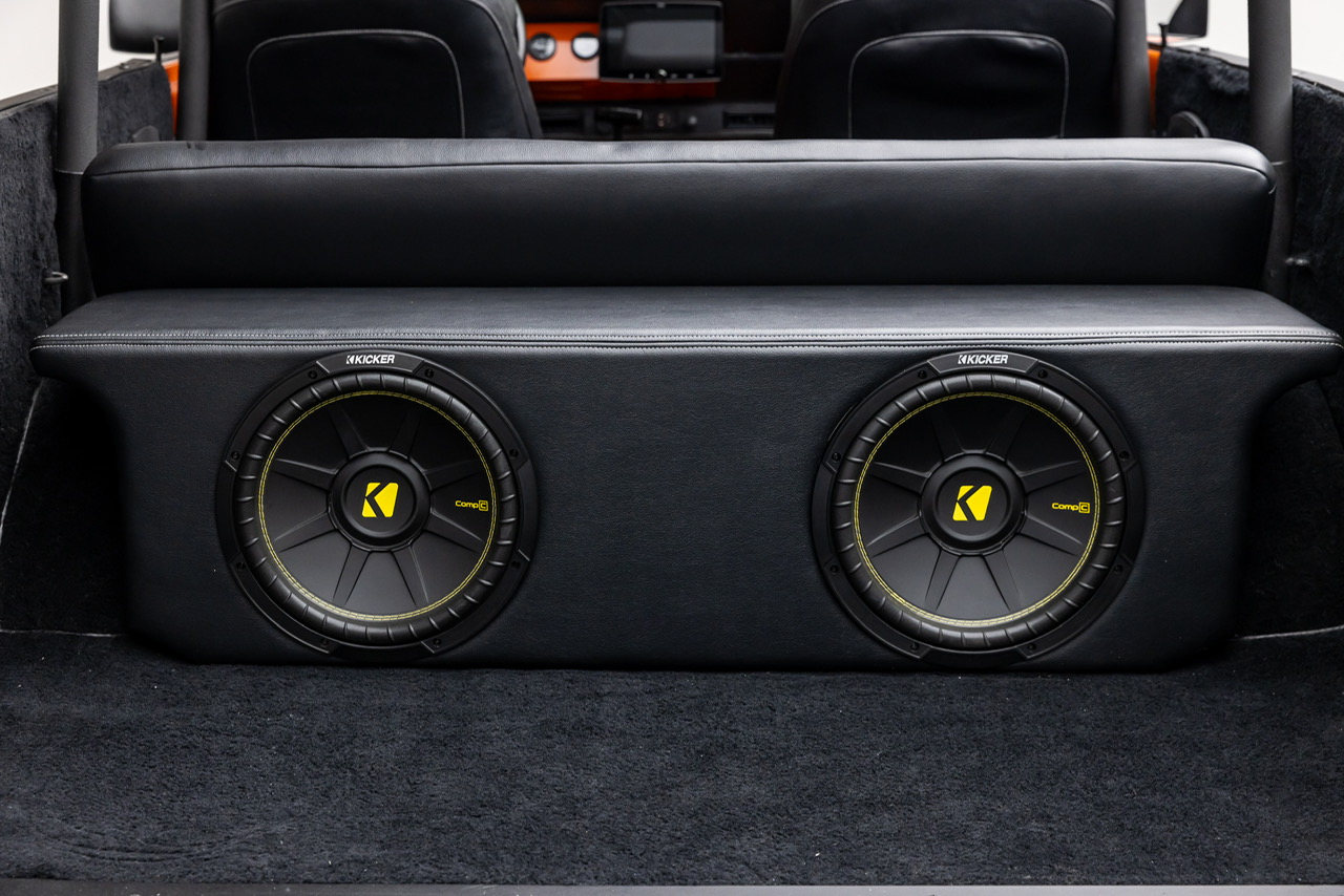 rear cargo area of an international scout with custom black speaker box and dual kicker subwoofers scout club ca